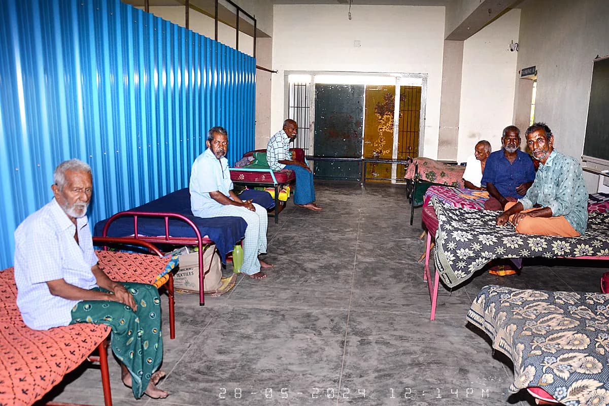 Residents seated together in the men's living room